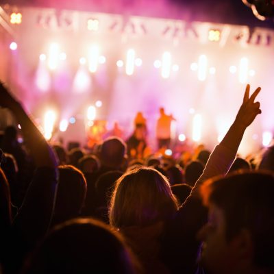 Crowds of people having fun on a music concert